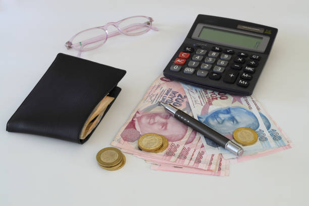 istock Turkish lira with a Calculator and a Pen 1415413445