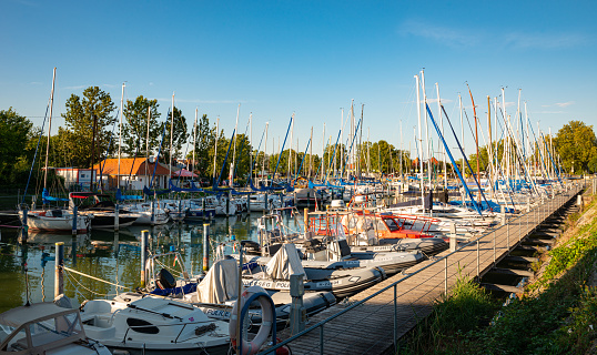 Fonyód, Hungary - July 2022: Sailing yachts in the port of Fonyód, on Lake Balaton in Hungary.