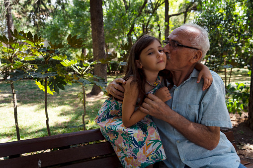 Grandfather and granddaughter spending time together in nature