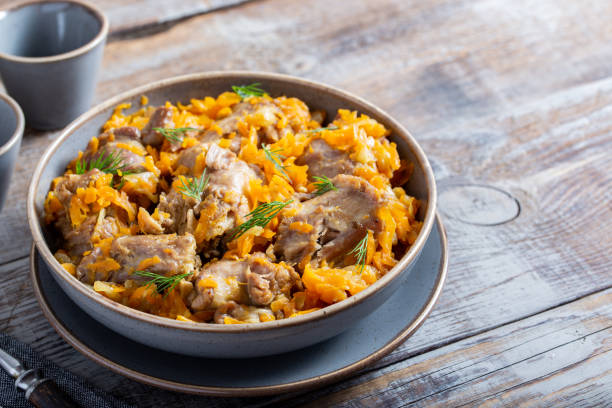 istock stewed turkey necks with vegetables, selective focus 1415420396