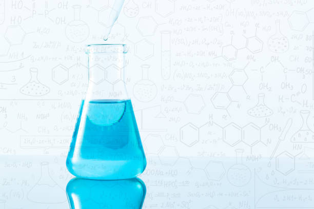 istock blue science test tube on white background,Laboratory glassware with colorful liquids on white background,Science blue glass tube experiment,Flask in scientist hand with test tubes,Laboratory glassware with a dropper dripping liquid into a test tube. scie 1415422575