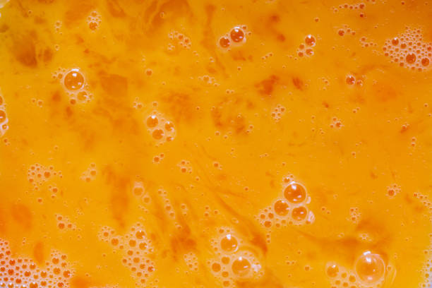 istock yolk texture,Egg yolks close-up. Background from egg yolks. 1415422591