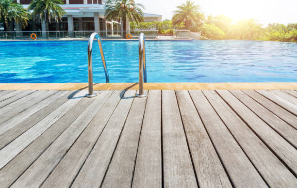 istock Swimming pool with stair and wooden deck 1415423328