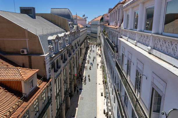 A view of Rua do Carmo from the Santa Justa Elevator platform Lisbon, Portugal - July 1, 2022: Rua do Carmo with street artists near the Santa Justa Elevator santa justa lift portugal stock pictures, royalty-free photos & images