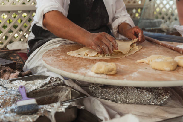 Woman filling Turkish flatbread Gozleme