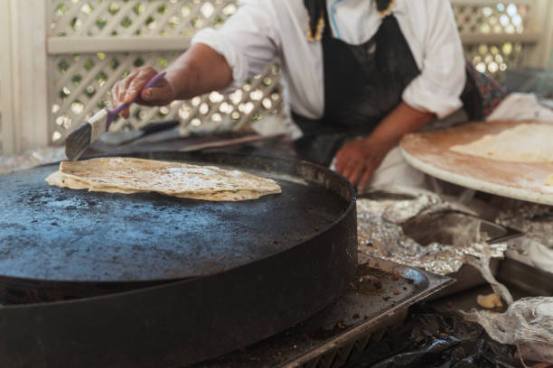 istock Female cook making Turkish pancake 1415424693