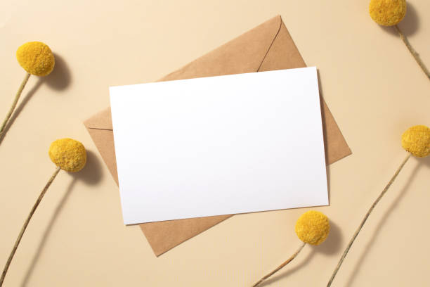 istock Invitation or greeting card mockup with craspedia flowers decorations. 1415425109