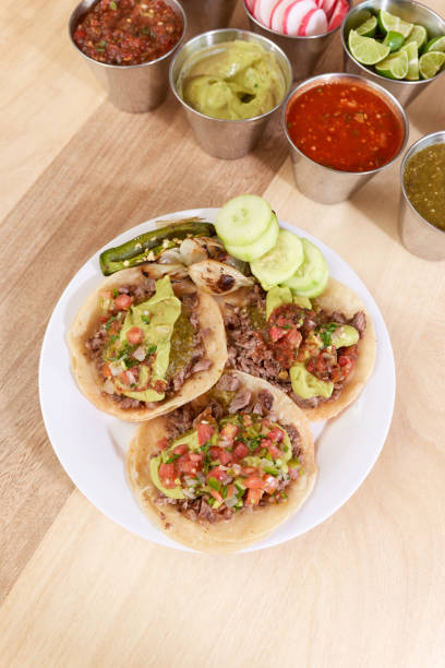 istock Mexican taco with salsa and a variety of toppings 1415430251