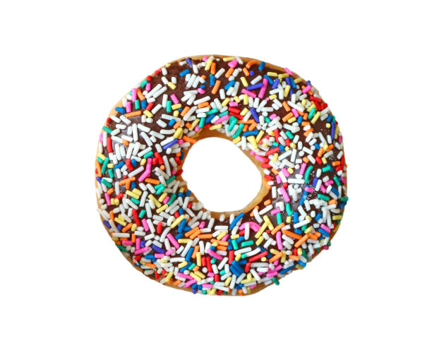 istock Chocolate glazed doughnuts with colorful sprinkles on white background 1415431573