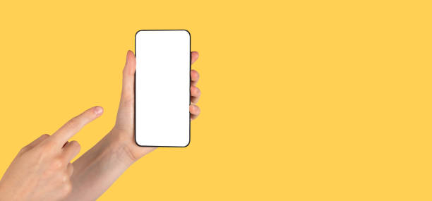 istock Banner with forefinger pointing to phone mockup on orange background. Android template with empty screen. Copy space 1415431801