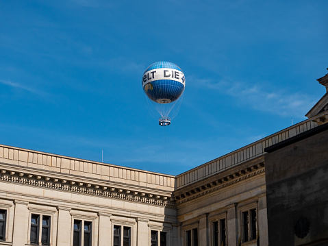 Berlin, The World Balloon (Weltballon) in the city of Berlin behind the Bundesrat building. People enjoy to hover over the city and having an unobstructed view.