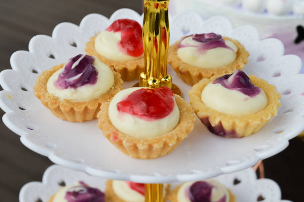 istock Freshly baked cheese tarts with different flavor on tray. 1415435142