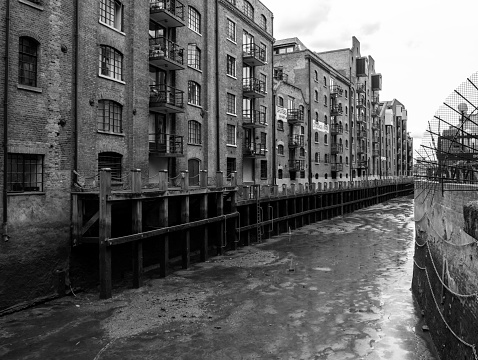 The River Neckinger enters the River Thames at St Saviour’s Dock on the southern bank of the river in Southwark, London. St Saviour’s Dock is tidal and is lined with former old warehouses, now transformed into trendy apartments, offices, shops and galleries.