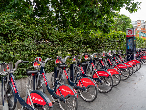Stretching into the distance, a long row of Santander rental cycles in a cycle bay in Tooley Street, Southwark, in South East London. (Also known as “Boris Bikes”!)
