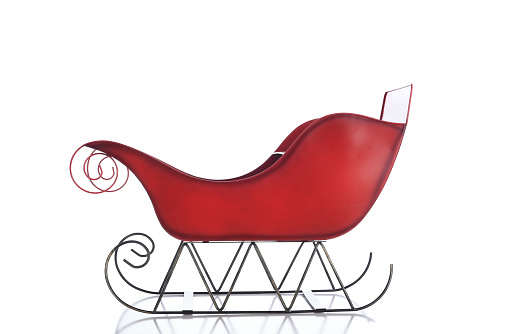 A red Christmas Sleigh isolated on white.