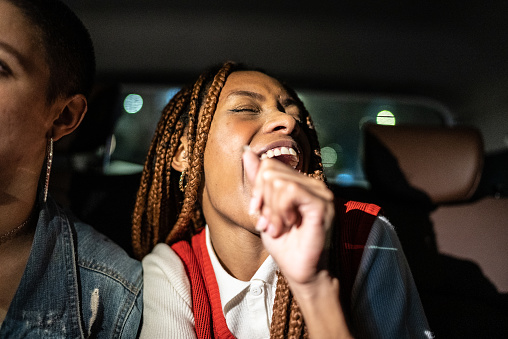 Friends singing in the car