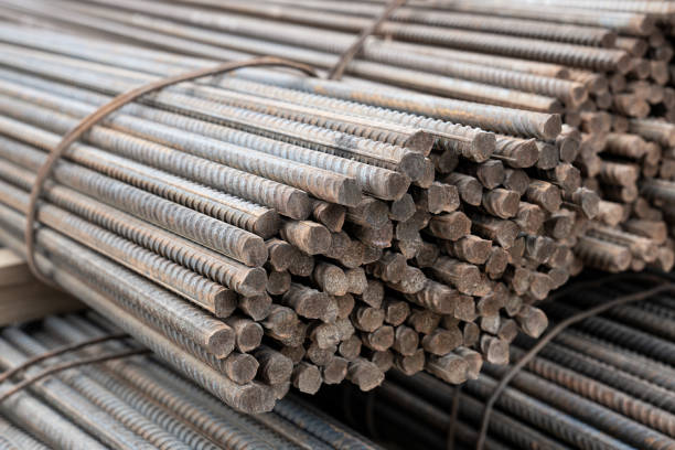 istock steel rebar for reinforcement concrete at Construction site with house under construction background 1415451497