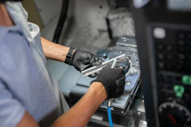 istock Blowing air to a metal piece with compressor 1415453939