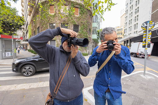 São Paulo, SP, Brazil, AUG 17, 2022,  two photographers on the corner of Araujo street and São Luis avenue in downtown São Paulo