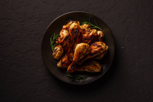 istock fried chicken on a plate with spices flat lay 1415455475
