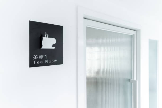 istock Black teahouse sign on white wall 1415461248