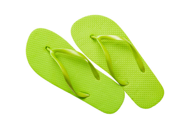 Green flip flops isolated on white background. Top view stock photo