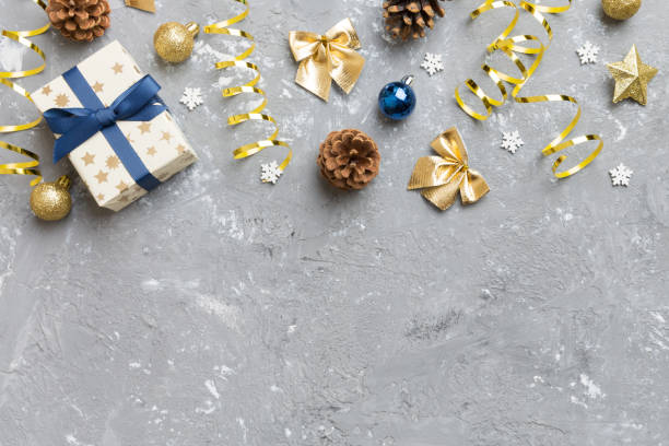 istock New Year composition. Christmas decor background with pine cones. Top view with copy space 1415464454