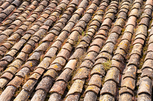 Weathered old clay roof tiles in Spain.