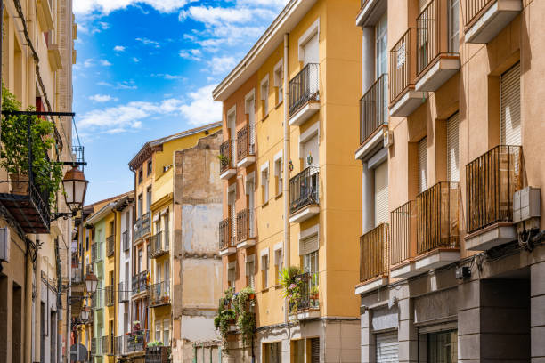 Colorful town homes on narrow street in Logrono, Spain.