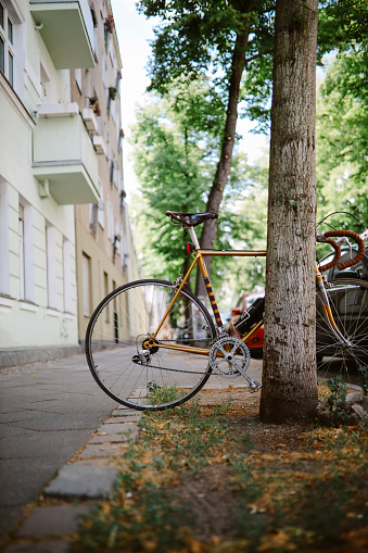 Parked bicycles in Berlin residential area of Neukölln in the summer.