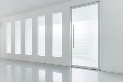 White doors and glass walls of the room