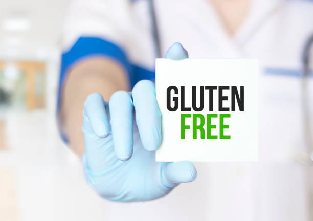 istock Gluten Free - Physician with paper on white background 1415471787