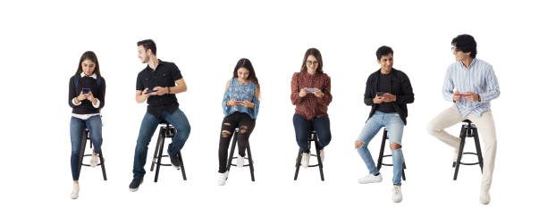 istock Latin students sitting in line and using phones 1415474312