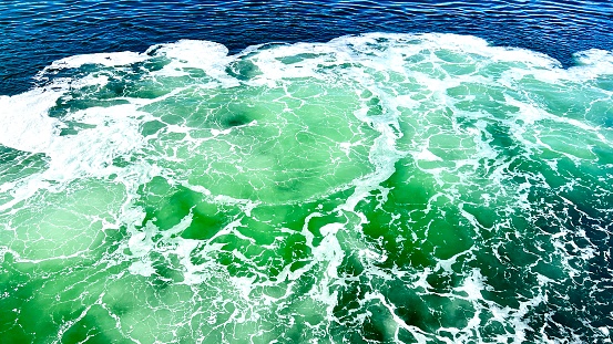 Waves of water of the river sea meet during high tide and low tide. Whirlpools of the maelstrom of Saltstraumen, Nordland, Norway Sea cliffs of the Mediterranean Sea, White Sea Turkey Deep Sea Foam