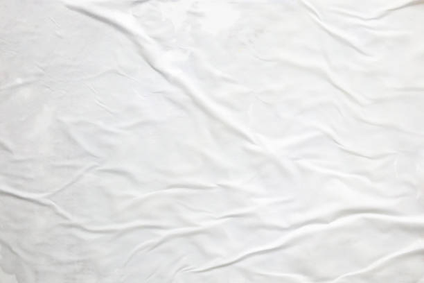 istock white crumpled and creased paper poster texture background 1415483148