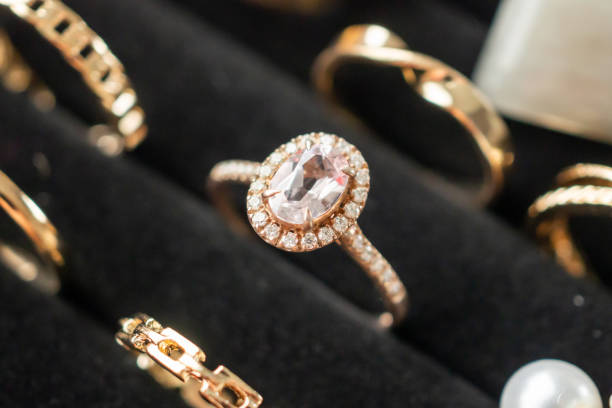 Gold jewelry diamond rings show in luxury retail store display showcase stock photo