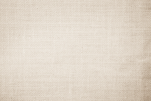 Lienzo de arpillera de yute hessian lienzo de textura tejida patrón de fondo en blanco marrón crema beige claro. Tejido natural de fibra de lino y textura de tela de algodón como limpio vacío para la decoración. photo