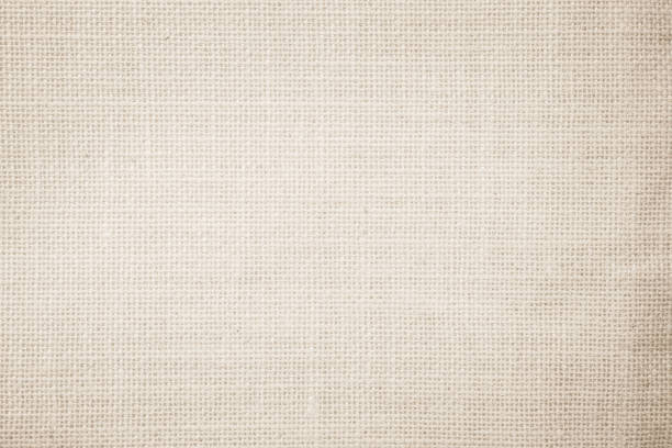 Jute hessian sackcloth burlap canvas woven texture background pattern in light beige cream brown color blank. Natural weaving fiber linen and cotton cloth texture as clean empty for decoration. Jute hessian sackcloth burlap canvas woven texture background pattern in light beige cream brown color blank. Natural weaving fiber linen and cotton cloth texture as clean empty for decoration. textile industry stock pictures, royalty-free photos & images