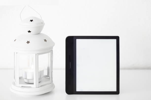 E-book  on white  book shelf with lantern Modern reader device mocke up. Copy space