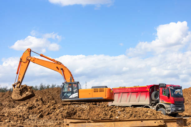 istock Excavator and Dump Truck on the construction site 1415488668