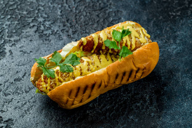 istock hot dog with breaded fish on dark stone table 1415488993