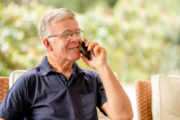 istock Happy senior man talking in the cell phone 1415489952