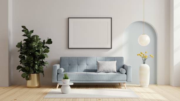 istock Poster frame mock up with blue sofa and decor in living room. 1415491365