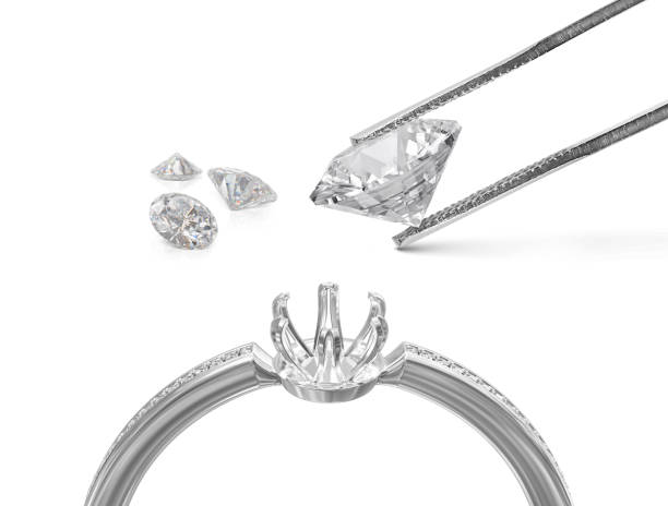 istock White gold or silver ring without gemstone and Excellent cut diamonds held by tweezers on a white background. 3d render 1415492529