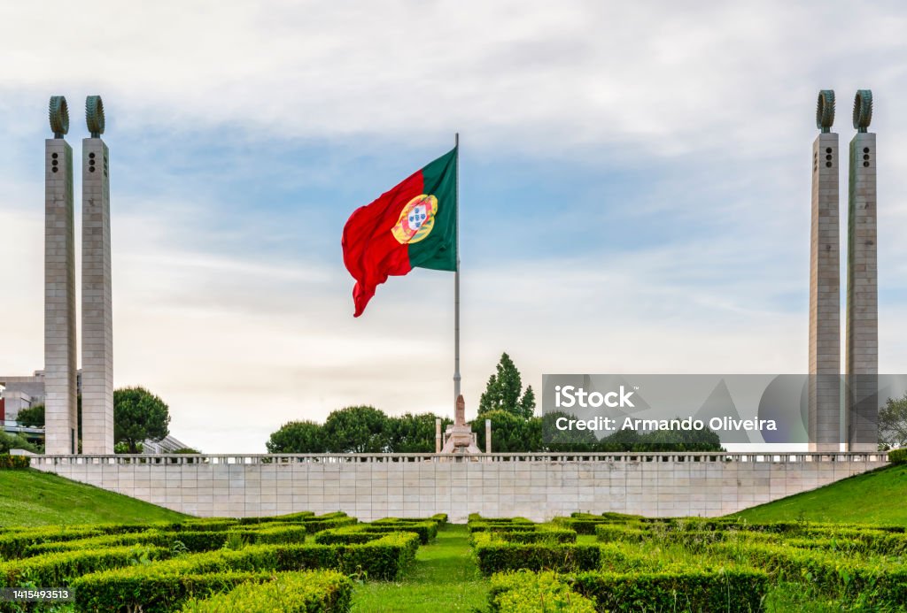 Parque Eduardo VII in Lisbon, Portugal Edward VII park (Parque Eduardo VII) in Lisbon, a green space in the center of the city - Flag of Portugal waving in the center of the columns - Travel concept Architectural Column Stock Photo
