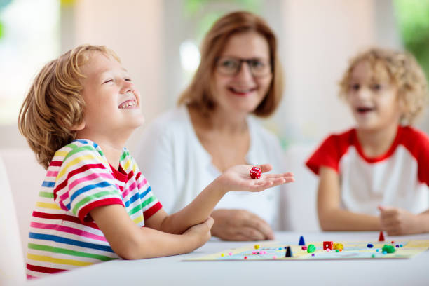 istock Family playing board game. Kids play. 1415494791