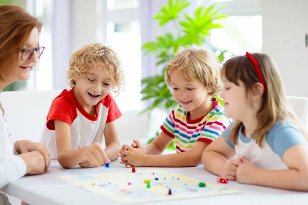 istock Family playing board game. Kids play. 1415495627