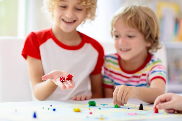 istock Family playing board game. Kids play. 1415495659
