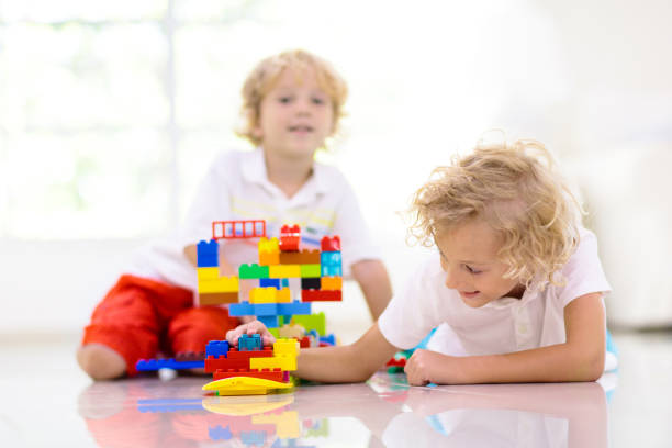 istock Child playing with toy blocks. Kids play. 1415497026