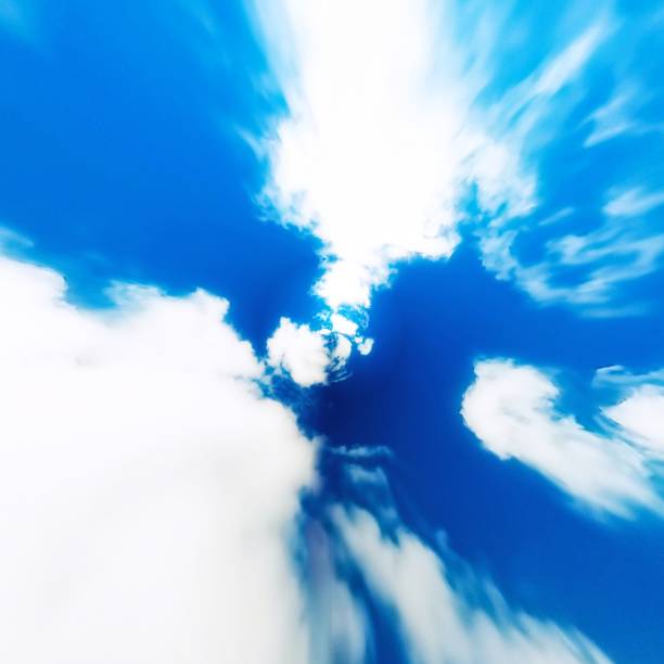 istock 3D illustration of blue sky with clouds and sun 1415499276